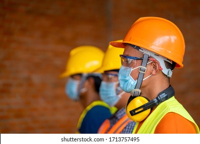 Technician wear protective face masks safety for Coronavirus Disease 2019 (COVID-19) in machine industrial factory,Coronavirus has turned into a global emergency. - Shutterstock ID 1713757495