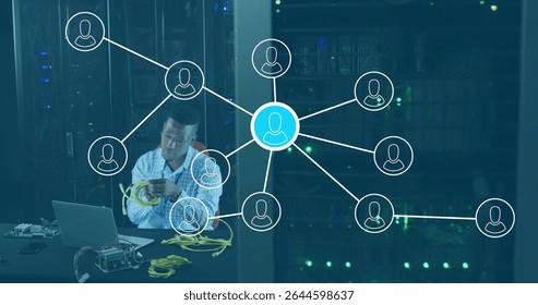 Technician wearing shirt connecting yellow Ethernet cables in server room, with laptop, copy space. Technology, data center, connectivity, network, it, infrastructure, digital