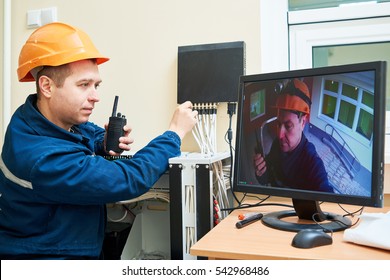 Technician Worker Adjusting Video Surveillance System