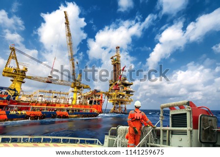 Technician or worker on the crew boat during transfer to platform or drilling rig  in process oil and gas platform offshore,technician