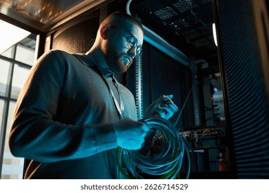Technician Working Inside Network Server Room