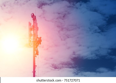 Technician Working On Communication Tower On Sunset Blue Sky