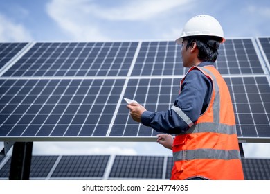 Technicians are checking the operation of the solar power plant equipment so that the power generation can operate at full capacity. Alternative energy to conserve the world's energy. - Shutterstock ID 2214774985