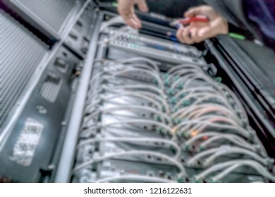 Technicians connecting network cable. Network connection concept defocus