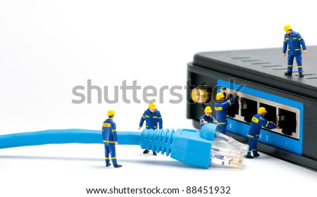 Technicians connecting network cable. Network connection concept