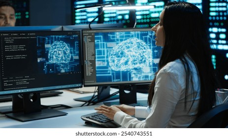 Technicians coworkers using AI tech on computer to do checkup in server room. Teamworking colleagues in data center using artificial intelligence technology to process datasets for training, camera A