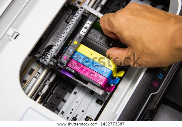 Technicians are install\
setup the ink cartridge or inkjet cartridge is a component of an\
inkjet printer 