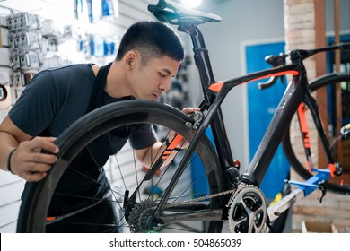 Technicians are repairing bicycles at shop sells - Powered by Shutterstock