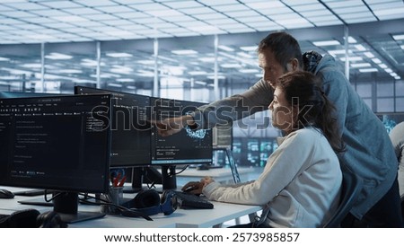 IT technicians in server farm brainstorming ways to repair equipment storing datasets. Colleagues at work in data center discussing how to mend rigs doing computational operations, camera B