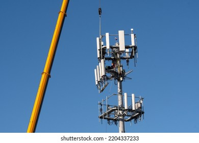 Technicians Upgrade A Cellular Network Tower In Bethany Beach, DE.