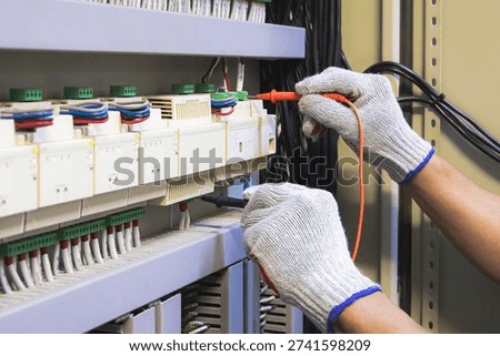 Technicians use multimeter to test or diagnose electrical control devices.