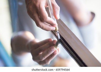 Technicians are using cutting tools, cut glass according to customer size