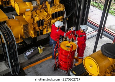 Technicians Using Safety Equipment Is Performing Maintenance On A Diesel Engine At A Power Plant At A Private Power Plant In Bangka Belitung.  November 14th 2014