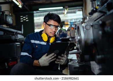 Technicians, Workers, Asia
 Engineers Working With Metal Lathes In Industrial Plants. A Mechanic Works On A Metal Lathe In A Factory. CNC Laser Cutting Industrial Technology. Steel Mill Industry