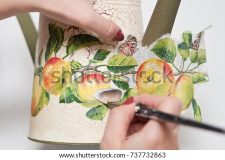 technique decoupage. decorating objects with paper napkins with a pattern. A ready-made drawing is used and an appliqué is made.