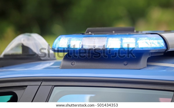 technological blue flashing of the police car during
a chase between
cars