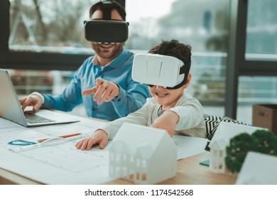 Technological developments. Cute happy boy feeling excited while being in virtual reality glasses