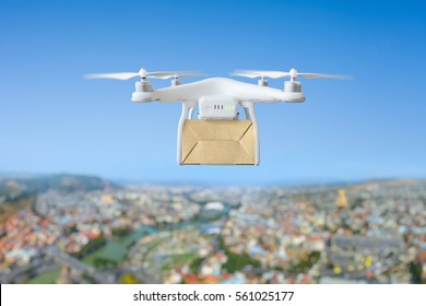 Technological Shipment Innovation - Drone Fast Delivery Concept, Multicopter Flying With Cardboard Box Above City 