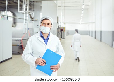 Technologist man at food factory . - Shutterstock ID 1360398143