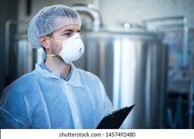 Technologist Working In Food Processing Factory For Medical Production Checking Quality And Distribution.