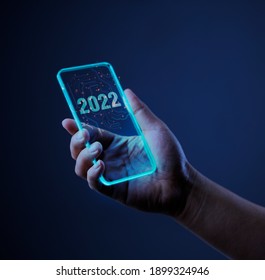 Technology 2022 With Mobile Phone. Isolated On Dark Background. Concept Vision Technology Year 2022.