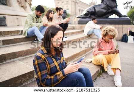 Technology addicts group of people ignoring each other using Mobile. Individualist people chatting with smart phone