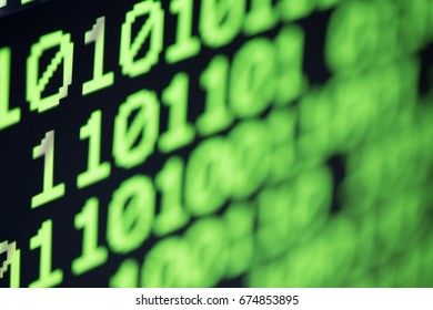 Technology background, close up on texture digital pixel is running primary code number with black background and selective focus.