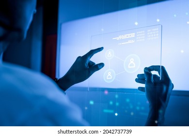 Technology background with man using transparent tablet - Powered by Shutterstock