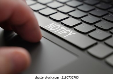 Technology and business concept. On the laptop keyboard of a person's hand, on the space bar there is an inscription - NOTIFY - Shutterstock ID 2190732783