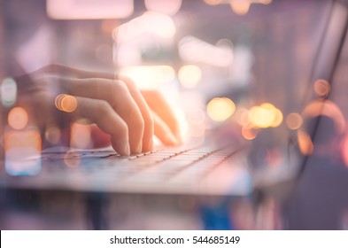Technology business and working concept. Close up woman hand using keyboard and notebook double exposure blur people bokeh light background. Shallow depth of field. Vintage tone filter color style.