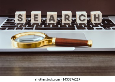 Technology Computer and Communication Concept, Search Information Data Networking Idea Creative and Wooden Cube With Alphabet Words on Keyboard Laptop., Searching on Internet Network Computing.