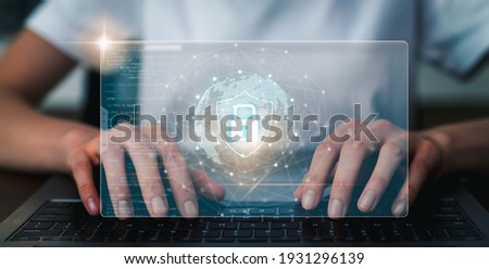 Technology concept with cyber security internet and networking, Businessman hand working on laptop, screen padlock icon on digital display.