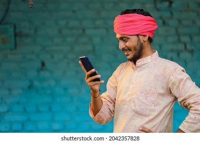 Technology concept : Indian farmer using smartphone - Shutterstock ID 2042357828