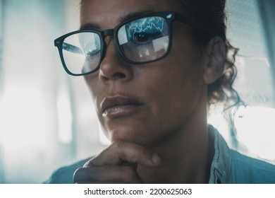 Technology Concept People Portrait With Digital Charts Reflected On Eyewear. One Woman In Business Online Modern Activity Looking A Display With Reflection On Glasses. Concept Of Businesswoman Alone