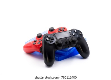 technology concept. video game controllers and CDs isolated on white