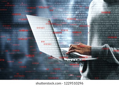 Technology and criminal concept. Hacker using laptop with digital business interface. Double exposure 