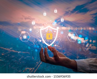 Technology cybersecurity and privacy concept. Protection and safe data for global network security. Businessman holding shield padlock protect icon.