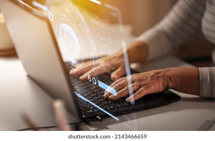 technology, cyberspace and programming concept - close up of senior woman hands typing on laptop at home and virtual hologram with data