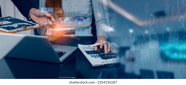 Technology and financial advisory services concept. Business teamwork and working on digital laptop computer with advisor showing plan of investment to clients at table office. Digital marketing. - Powered by Shutterstock