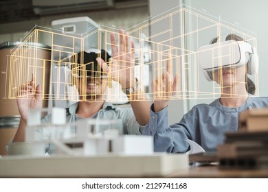Technology futuristic virtual reality design. Team Architect or Engineer designer wearing VR headset for BIM technology working together design 3D model building in office.