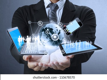 Technology in the hands of businessmen - Shutterstock ID 110678570
