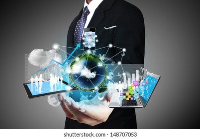 Technology in the hands of businessmen  - Shutterstock ID 148707053