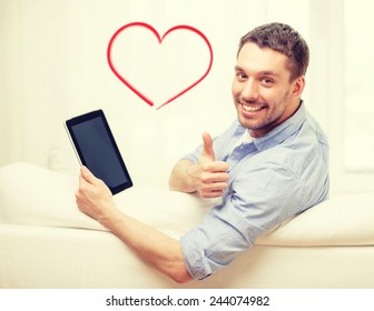 Technology, Home And Lifestyle Concept - Smiling Man Working With Tablet Pc Computer At Home Showing Thumbs Up