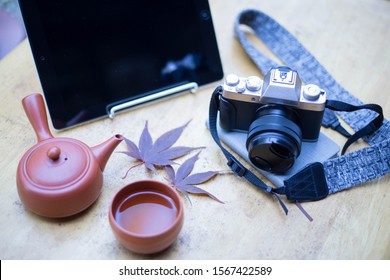 Technology image notebook phone camera only silver  Hand holding a hot tea glass