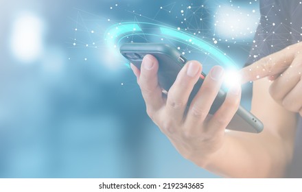 Technology innovation and communication concept of a man using a mobile smart phone digital internet social online with a global network connection.