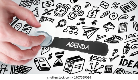 Technology, Internet and network concept. Young businessman shows the word: Agenda