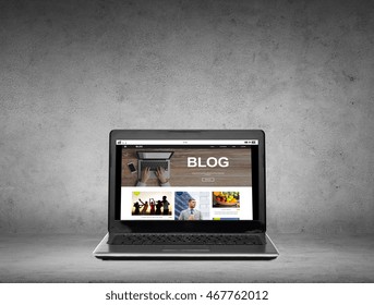 technology, mass media and internet concept - laptop computer with blog web page on screen over gray concrete background