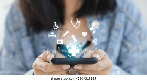 Technology network healthcare concept. Female using smartphone with virtual medical healthcare. Network connection online communication to hospital. - Powered by Shutterstock