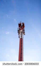 Technology On The Top Of The Telecommunication GSM 5G,4G,3G Tower.Cellular Phone Antennas On A Building Roof.Telecommunication Mast Television Antennas.Receiving And Transmitting Stations