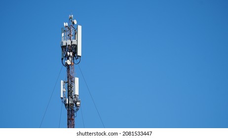 Technology On The Top Of The Telecommunication GSM 5G, 4G, 3G Tower.Cellular Phone Antennas On A Building Roof.silhouette Of Telecommunication Mast Television Antennas.